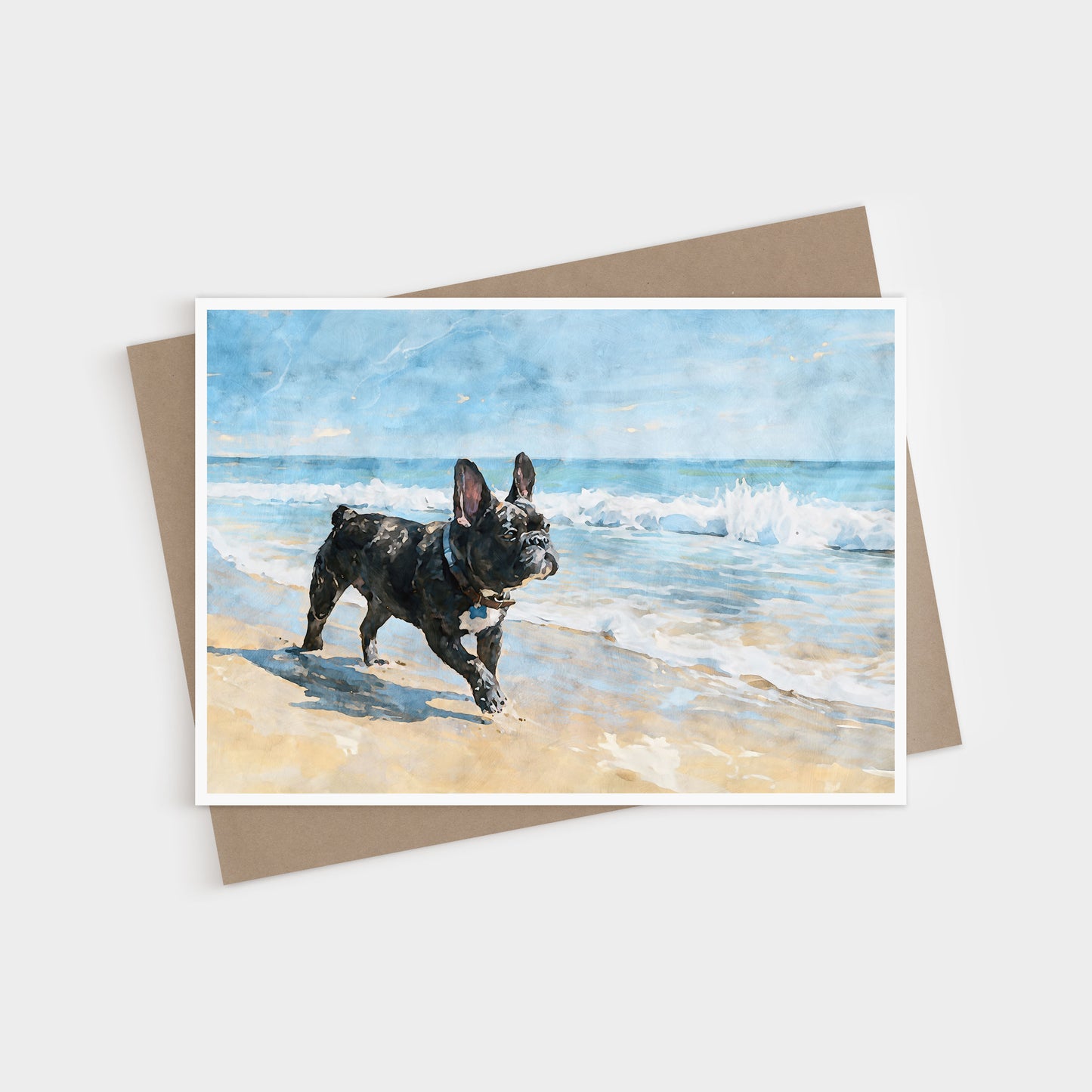 Brindle French Bulldog beach note card shown with a kraft envelope, featuring blue ocean waves and tan sand.