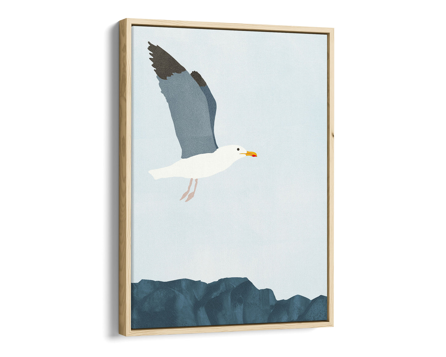 Natural wood framed canvas illustration of a seagull soaring above a rocky shoreline, with its wings spread wide against a pale blue sky.