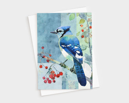 Watercolor illustration of a blue jay perched on a branch with red berries, set against a soft patchwork-style background of blue and green tones. The card rests on a white envelope, evoking a natural, serene feel perfect for all-occasion correspondence.