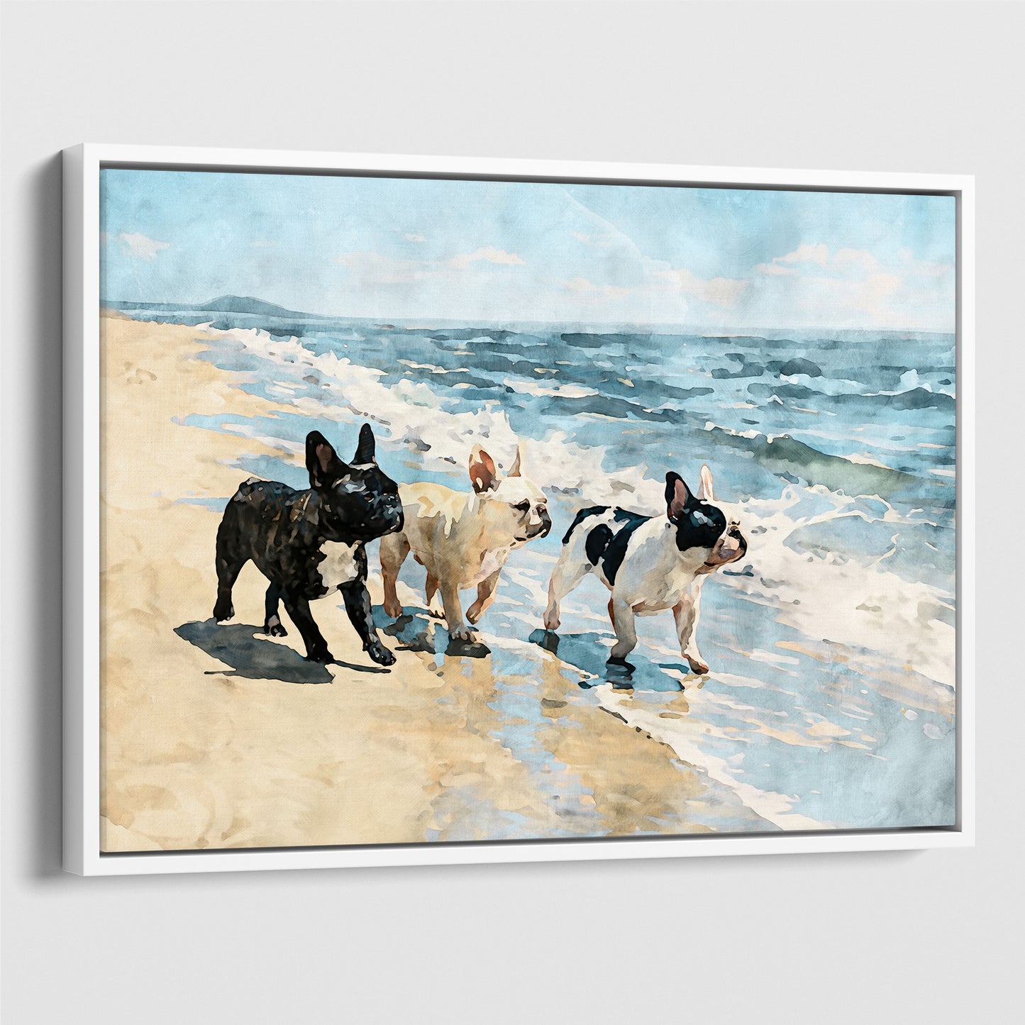 White float framed canvas of three French Bulldogs walking beside blue waves on a sandy beach.