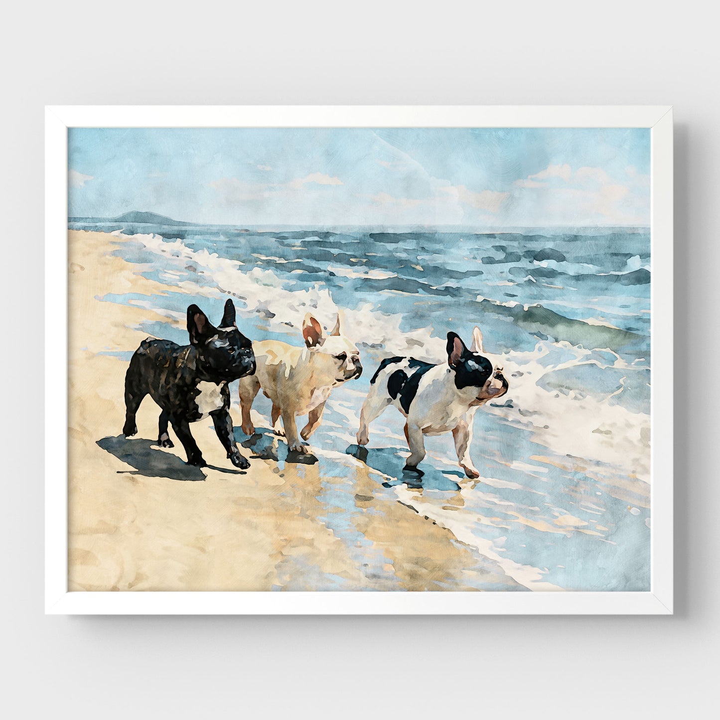 Three French Bulldogs coastal watercolor print with soft blue water, white surf, and sandy tan tones in a white frame.