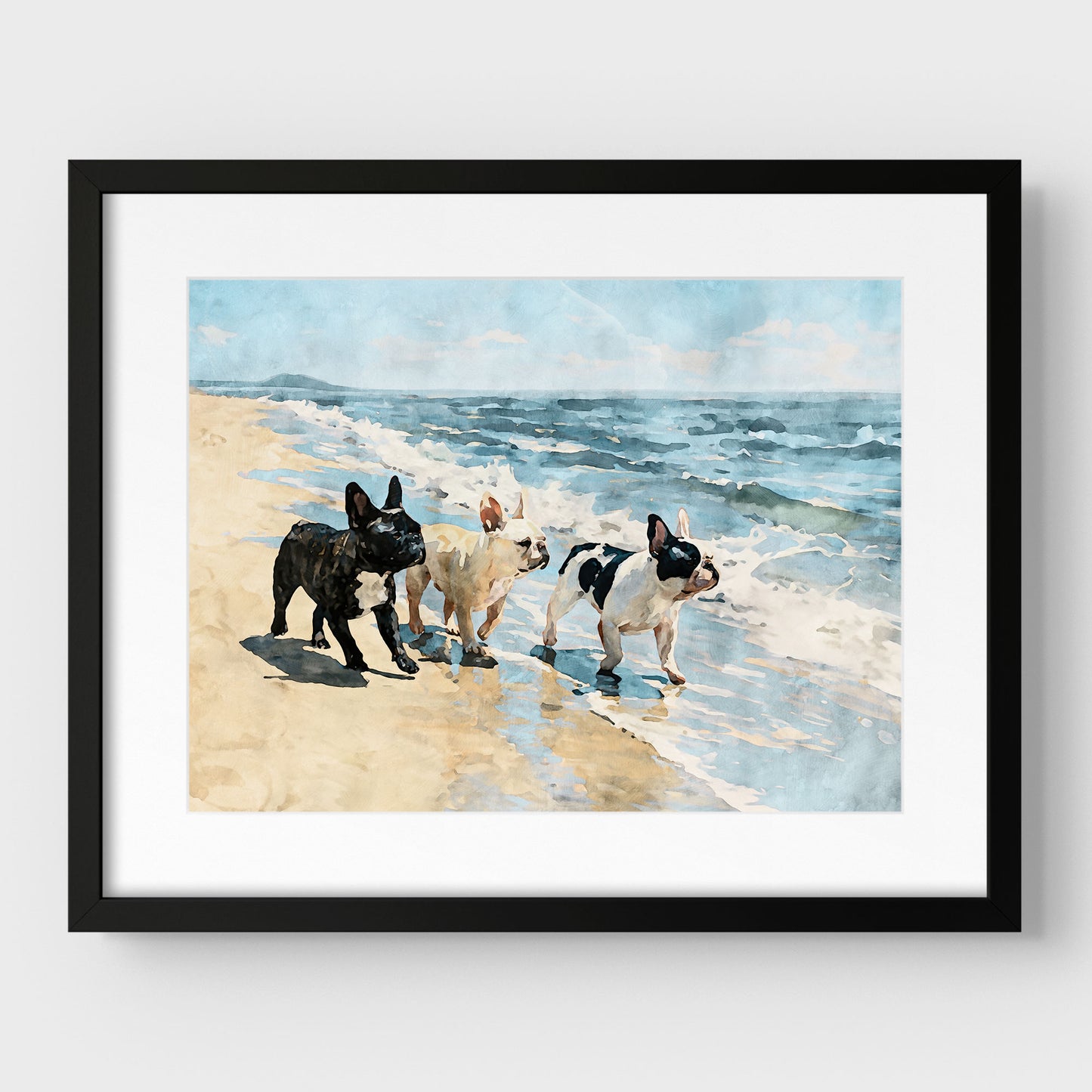 Matted black frame display of a three French Bulldogs beach watercolor print with blue waves and tan sand.