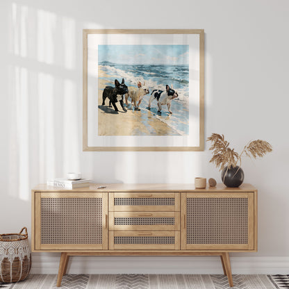 Square framed beach watercolor print featuring three French Bulldogs by blue ocean waves in a styled interior.