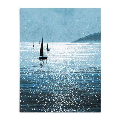 Vertical art print of a tranquil seascape with silhouetted sailboats drifting across shimmering blue water. White splatter-style highlights evoke sunlight dancing on the waves, while a misty headland appears in the distance beneath a pale, textured sky. Displayed on a clean white background, emphasizing the artwork’s crisp lines and reflective serenity.