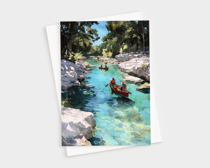 Watercolor-style greeting card showing two canoes gliding down a clear turquoise river, surrounded by rocky banks and tall green trees under a bright blue sky.