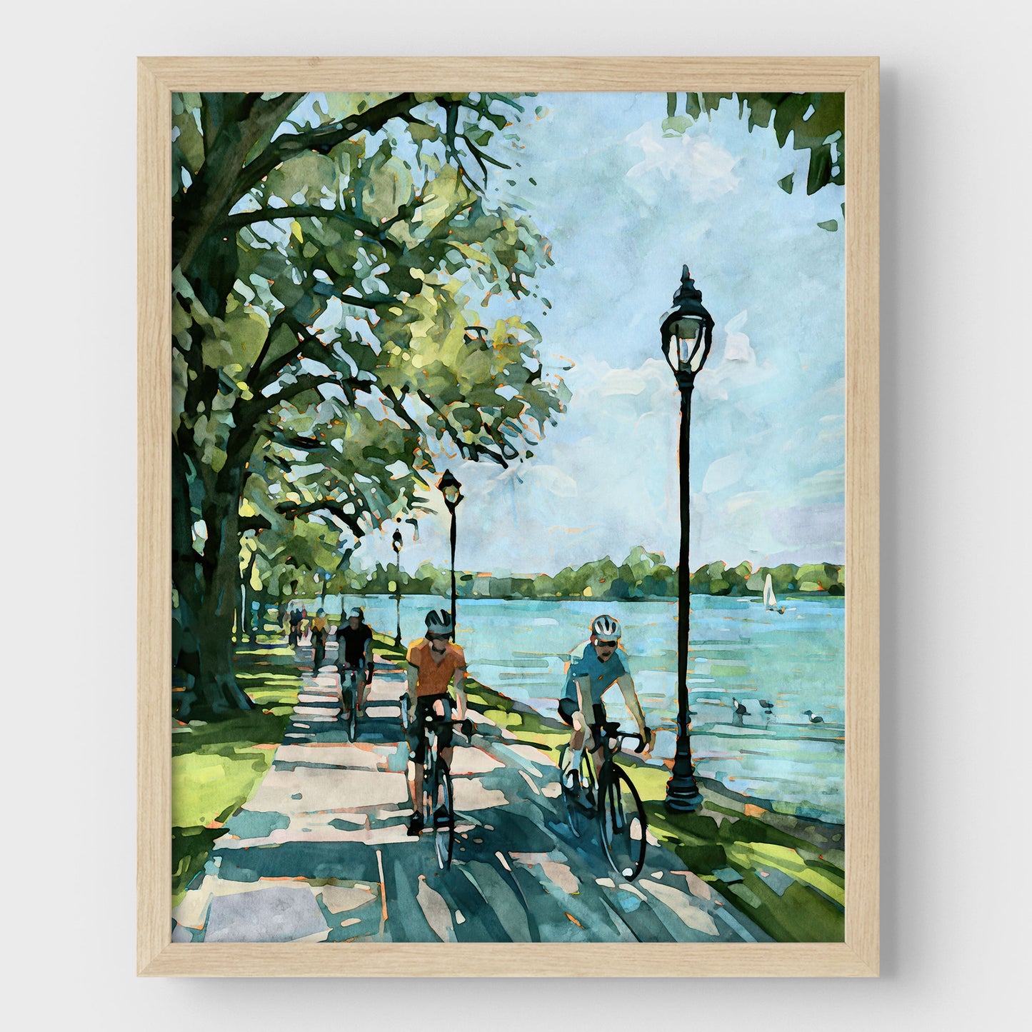 Watercolor-style Minneapolis Chain of Lakes bike path art print in a natural wood frame.
