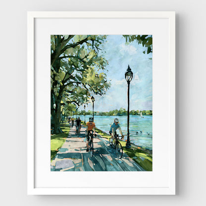 Matted watercolor-style Minneapolis lake bicycle print in a white frame.