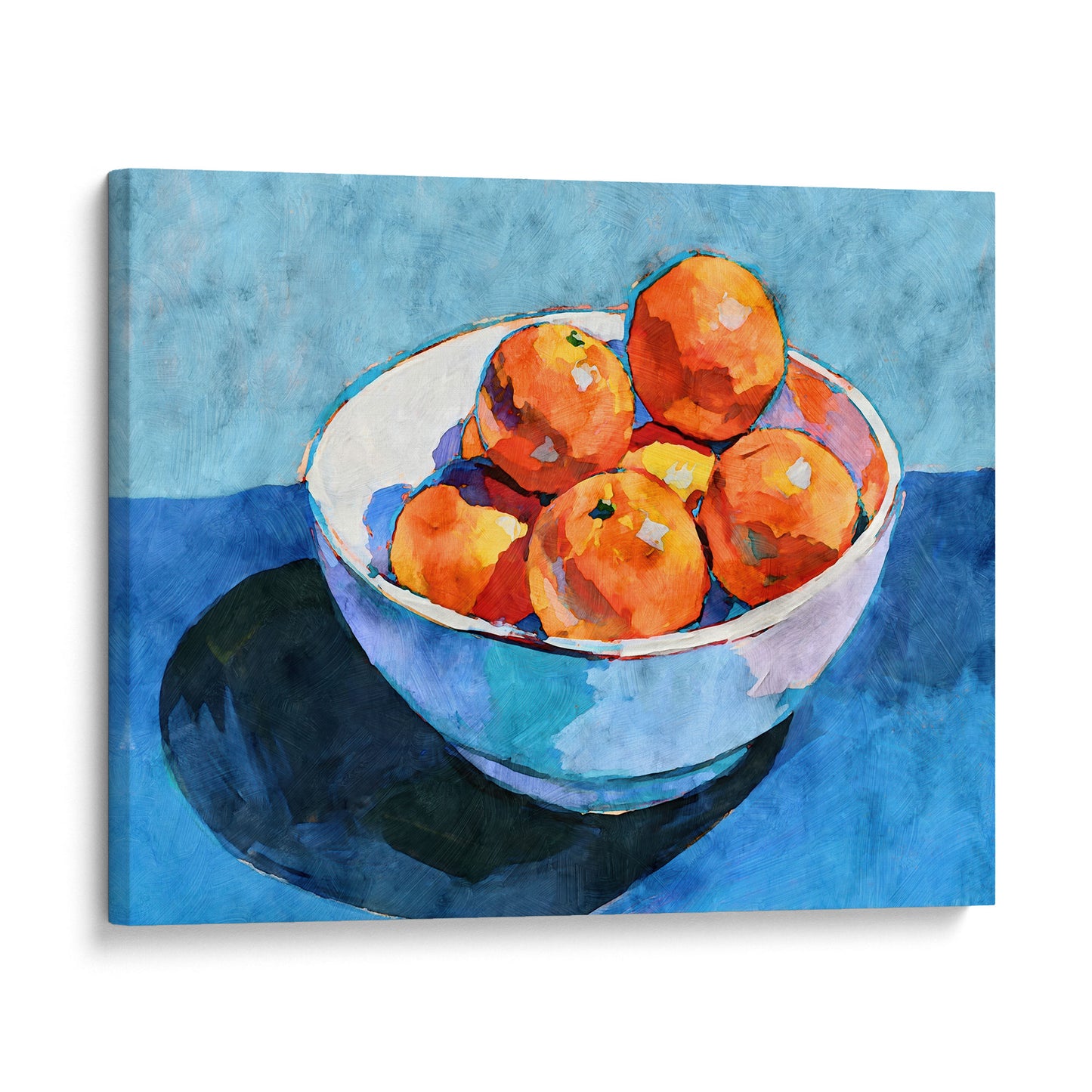 Gallery wrap canvas of a bowl of oranges still life with vivid orange citrus, white bowl, and rich blue background.