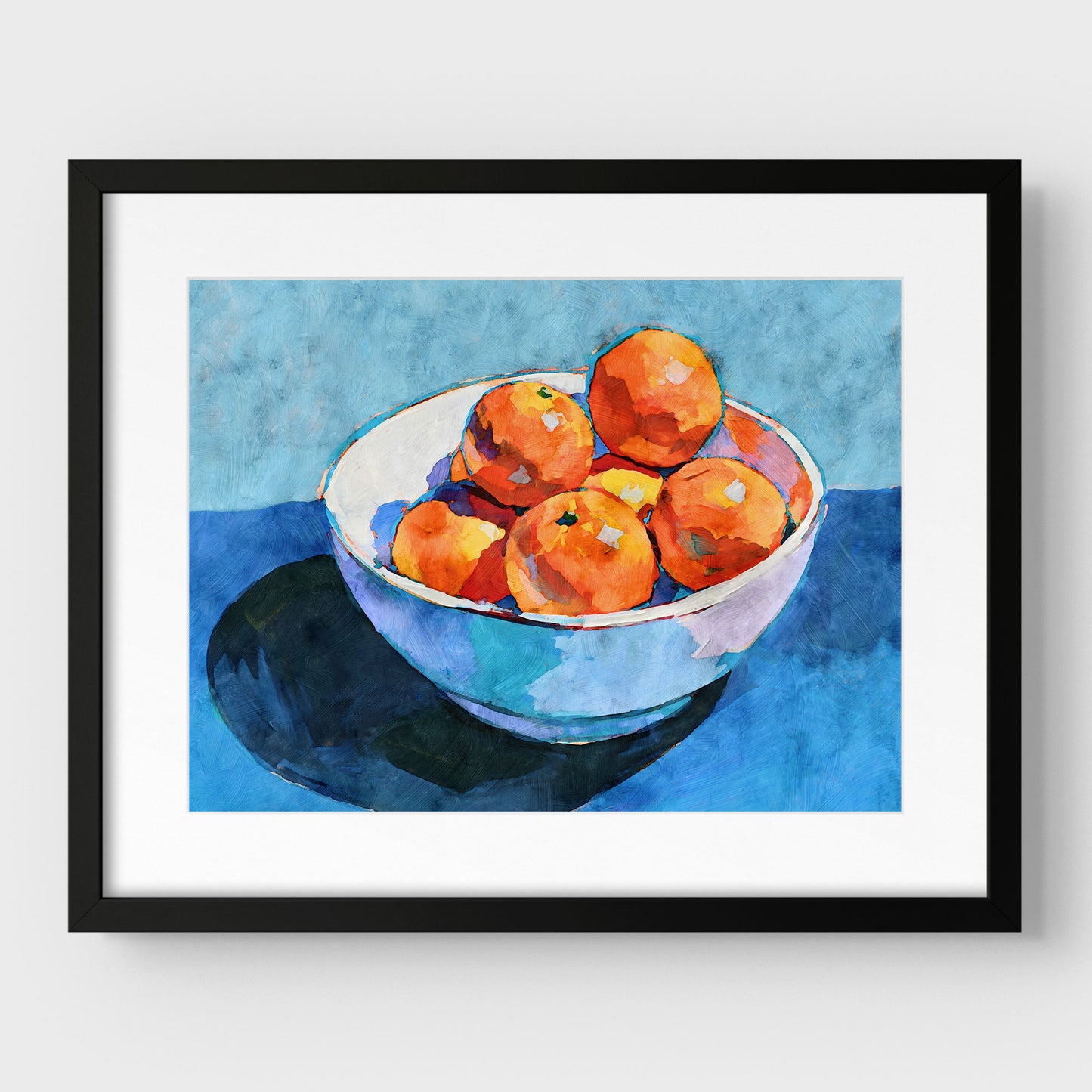 Bowl of oranges still life print in a black frame with mat, featuring orange fruit in a white bowl on blue.