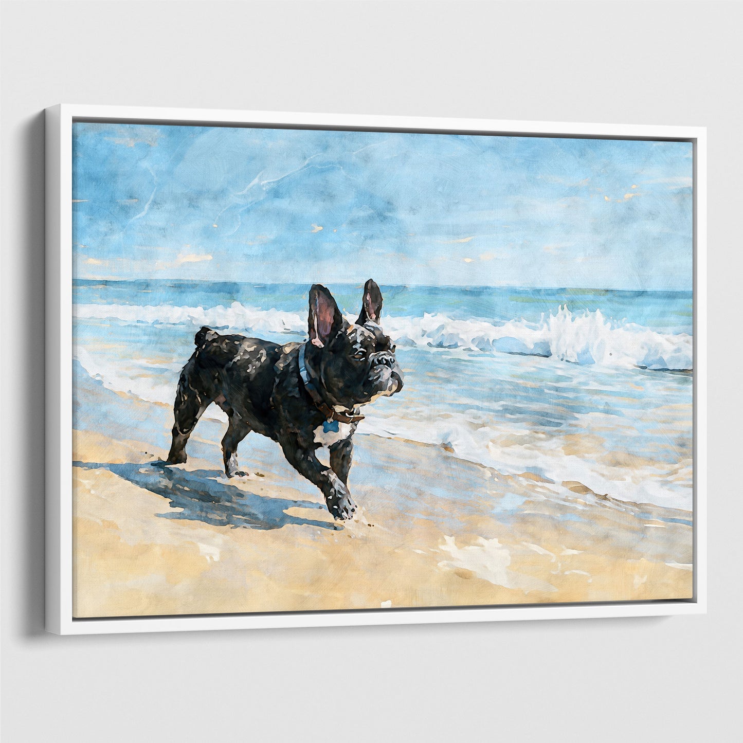 White float framed canvas showing a brindle French Bulldog on a beach with soft blue ocean waves.
