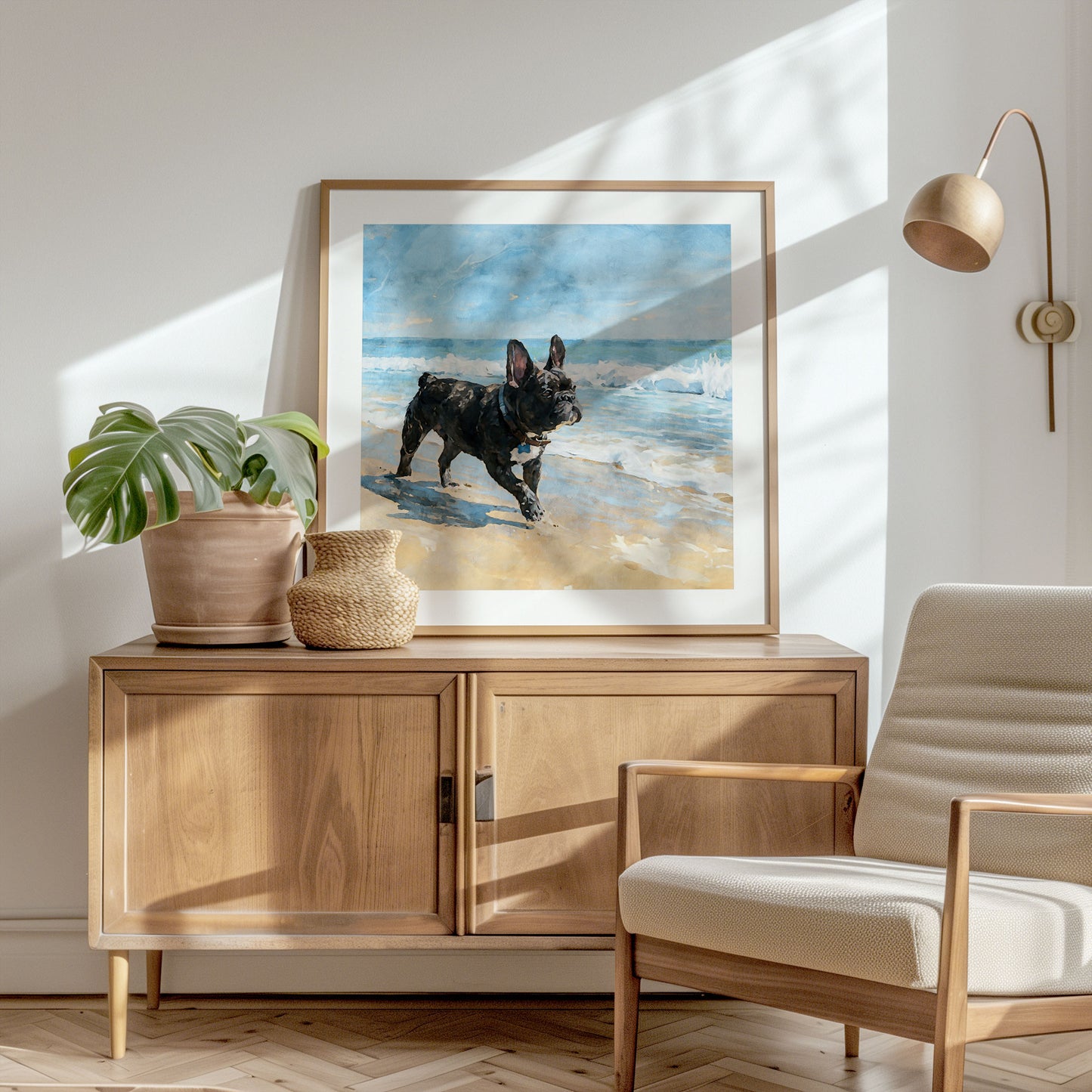 Square-format framed beach dog watercolor print featuring a brindle French Bulldog by blue waves in a styled interior.