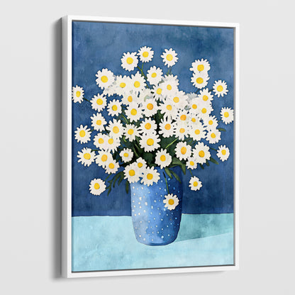 Canvas artwork with a white frame, featuring a watercolor-style depiction of white chamomile flowers with yellow centers arranged in a blue polka-dotted vase, set against a deep blue background and a light blue surface.