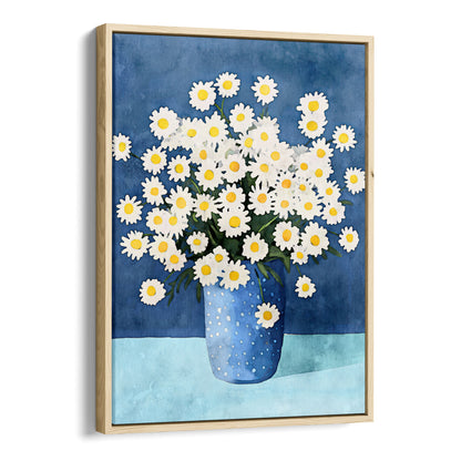 Canvas artwork with a natural wood frame, featuring a watercolor-style depiction of white chamomile flowers with yellow centers arranged in a blue polka-dotted vase, set against a deep blue background and a light blue surface.