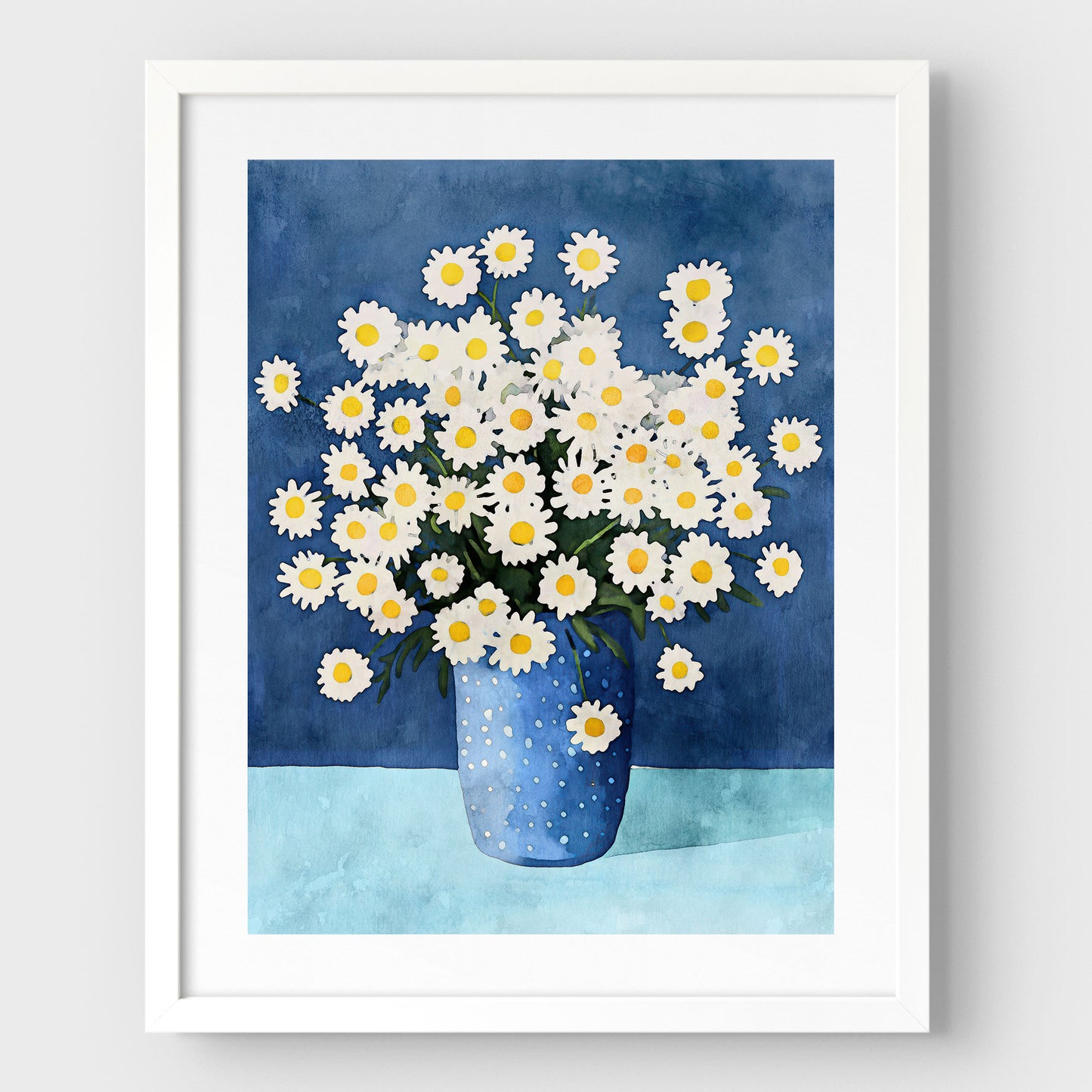 Artwork with a white frame and white border, featuring a watercolor-style depiction of white chamomile flowers with yellow centers in a blue polka-dotted vase, set against a deep blue background and light blue surface.