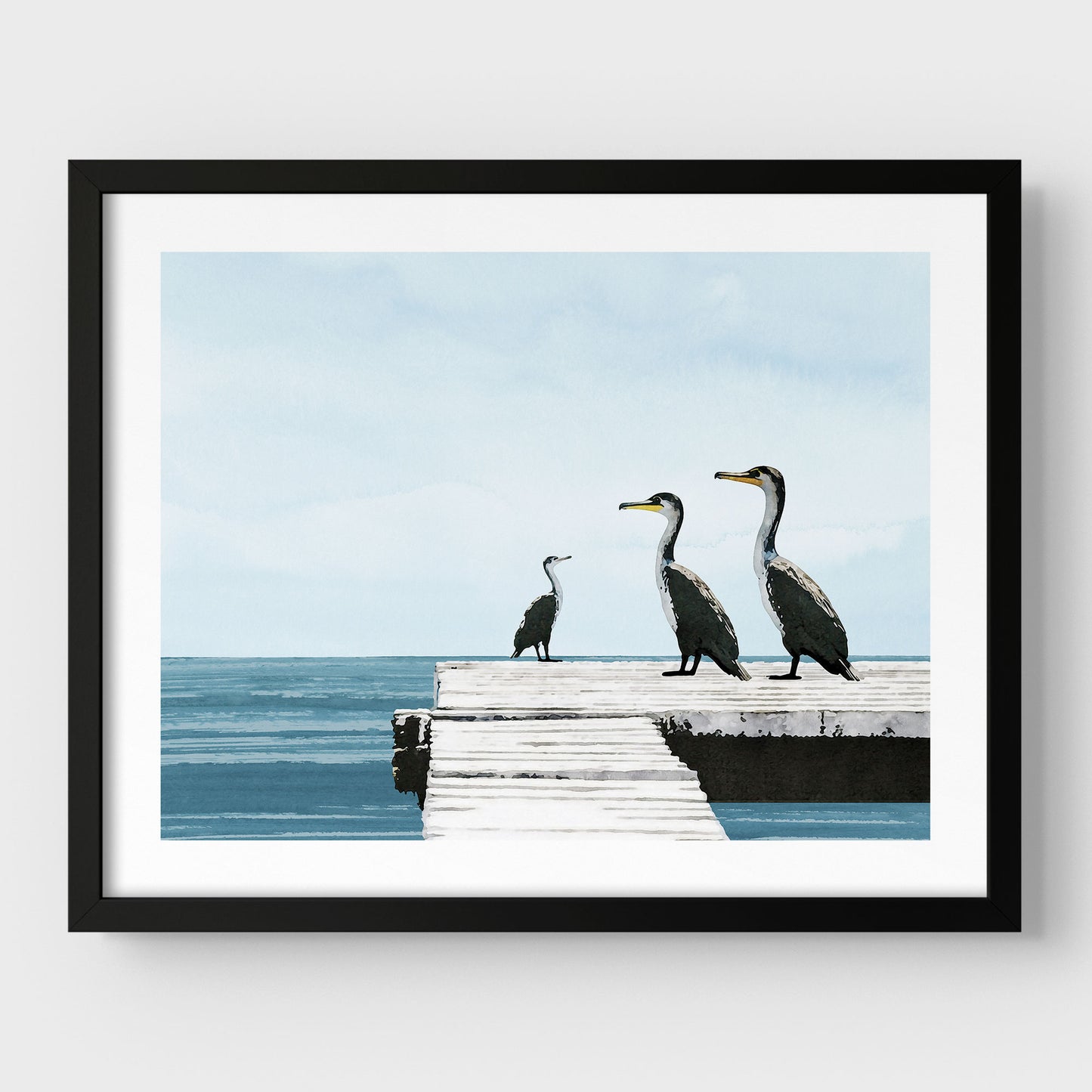 Black framed illustration of three cormorants standing on a white wooden dock over a calm blue ocean under a pale sky, with minimalist styling and clean lines against a white background.