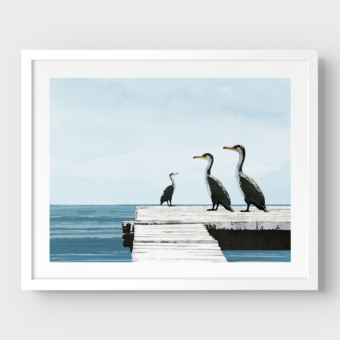 White framed illustration of three cormorants standing on a white wooden dock over a calm blue ocean under a pale sky, with minimalist styling and clean lines against a white background.