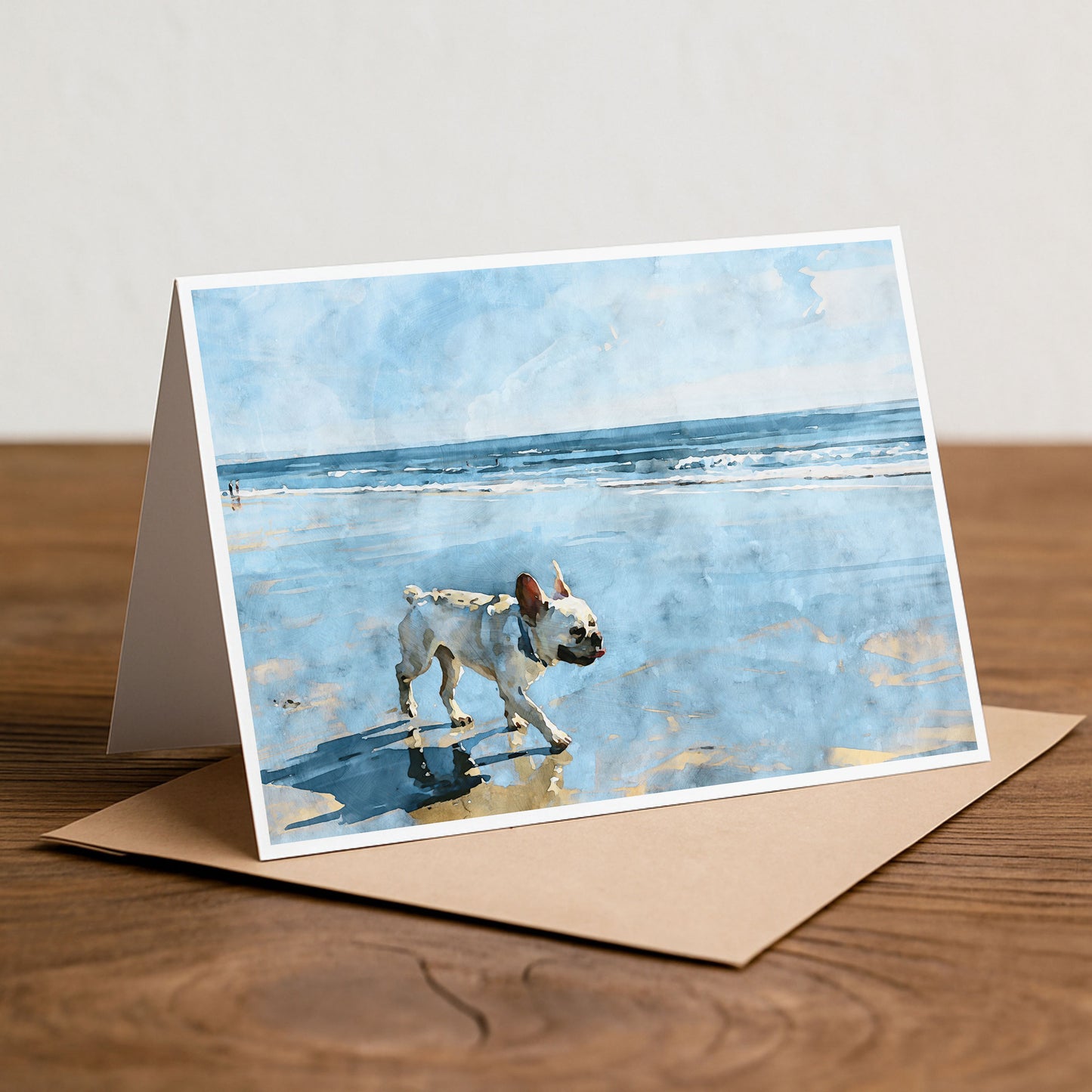 Cream French Bulldog beach note card styled on a tabletop with a light coastal watercolor theme.
