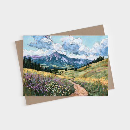 Greeting card with a mountain landscape painting on a white background