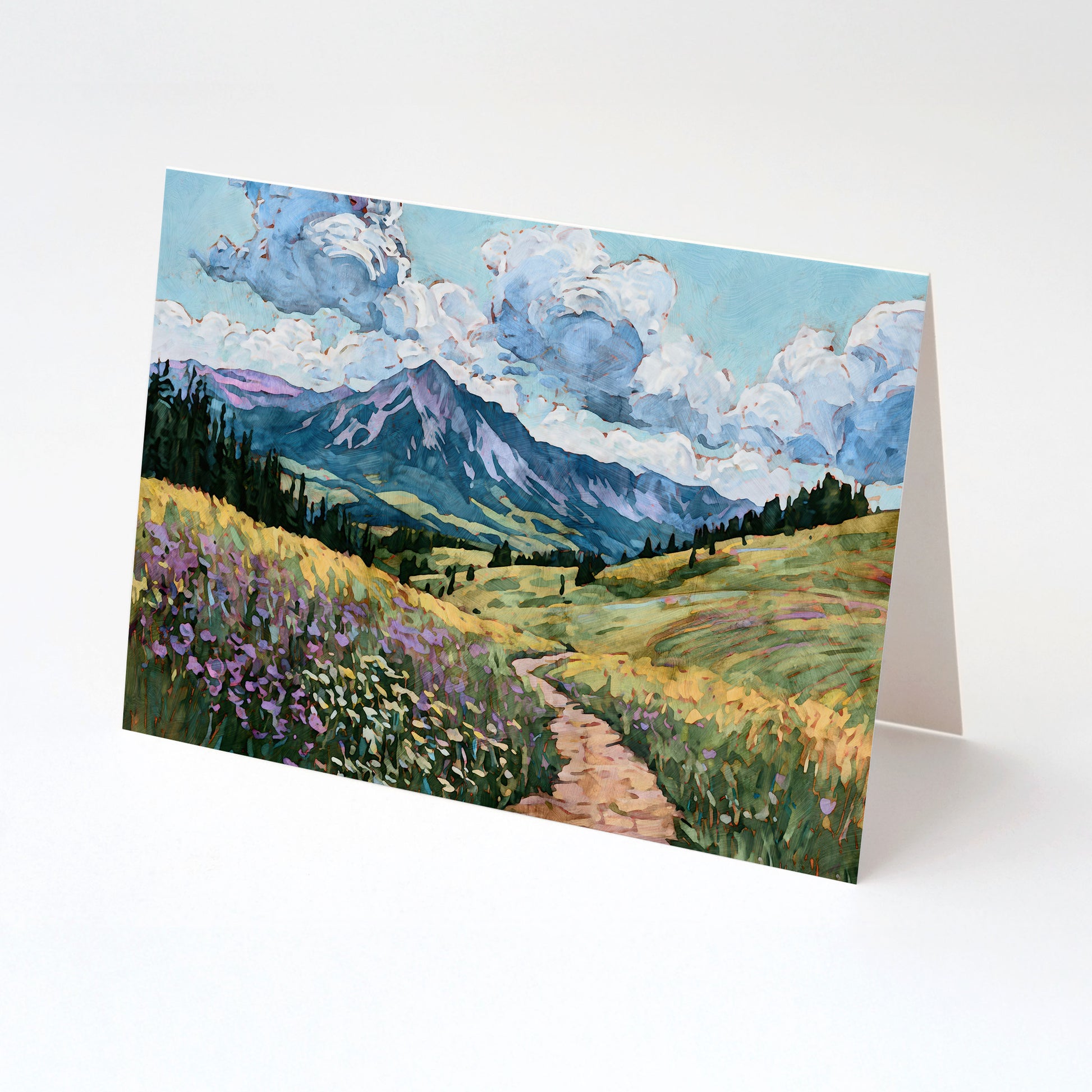 Greeting card with a mountain landscape design featuring a path and flowers.