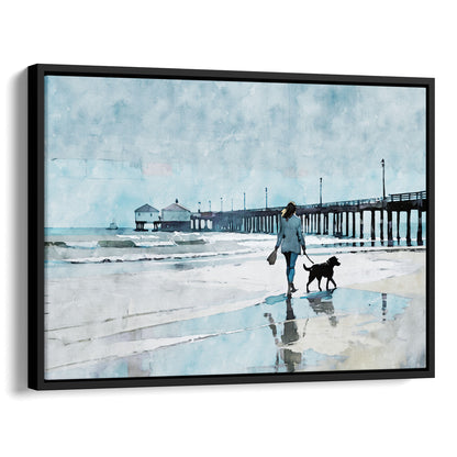 Watercolor-style illustration of a woman walking a dog along a wet beach with reflections, next to a long pier extending into the sea. Artwork printed on gallery wrap canvas in black floater frame.