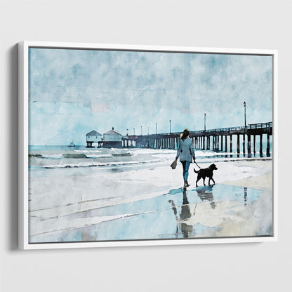 Watercolor-style illustration of a woman walking a dog along a wet beach with reflections, next to a long pier extending into the sea. Artwork printed on gallery wrap canvas in white floater frame.