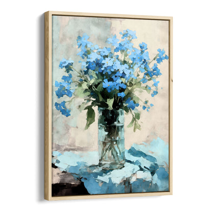 Framed watercolor painting of a bouquet of blue forget-me-not flowers arranged in a clear glass vase. The vase sits on a soft blue cloth, with a neutral background, evoking an impressionist style. The natural wood frame adds a modern touch to the artwork.