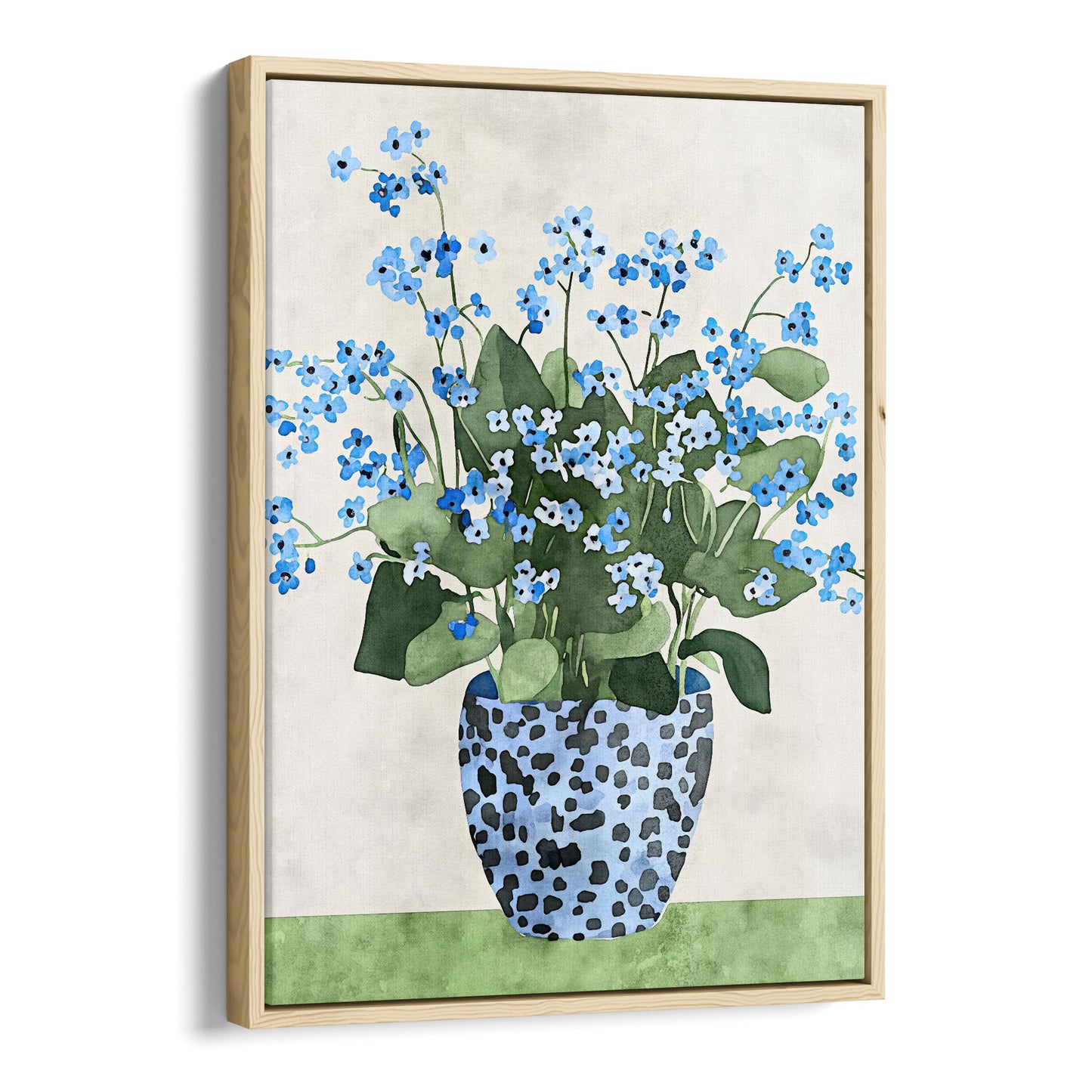 Canvas print with a natural wood frame, featuring a watercolor-style depiction of blue forget-me-not flowers with green leaves, arranged in a patterned blue vase, set against a soft neutral background with a green surface.