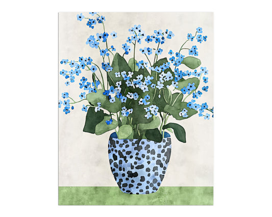 Unframed artwork featuring a vibrant bouquet of blue forget-me-not flowers with green leaves in a patterned blue vase, displayed on a green surface against a neutral background.