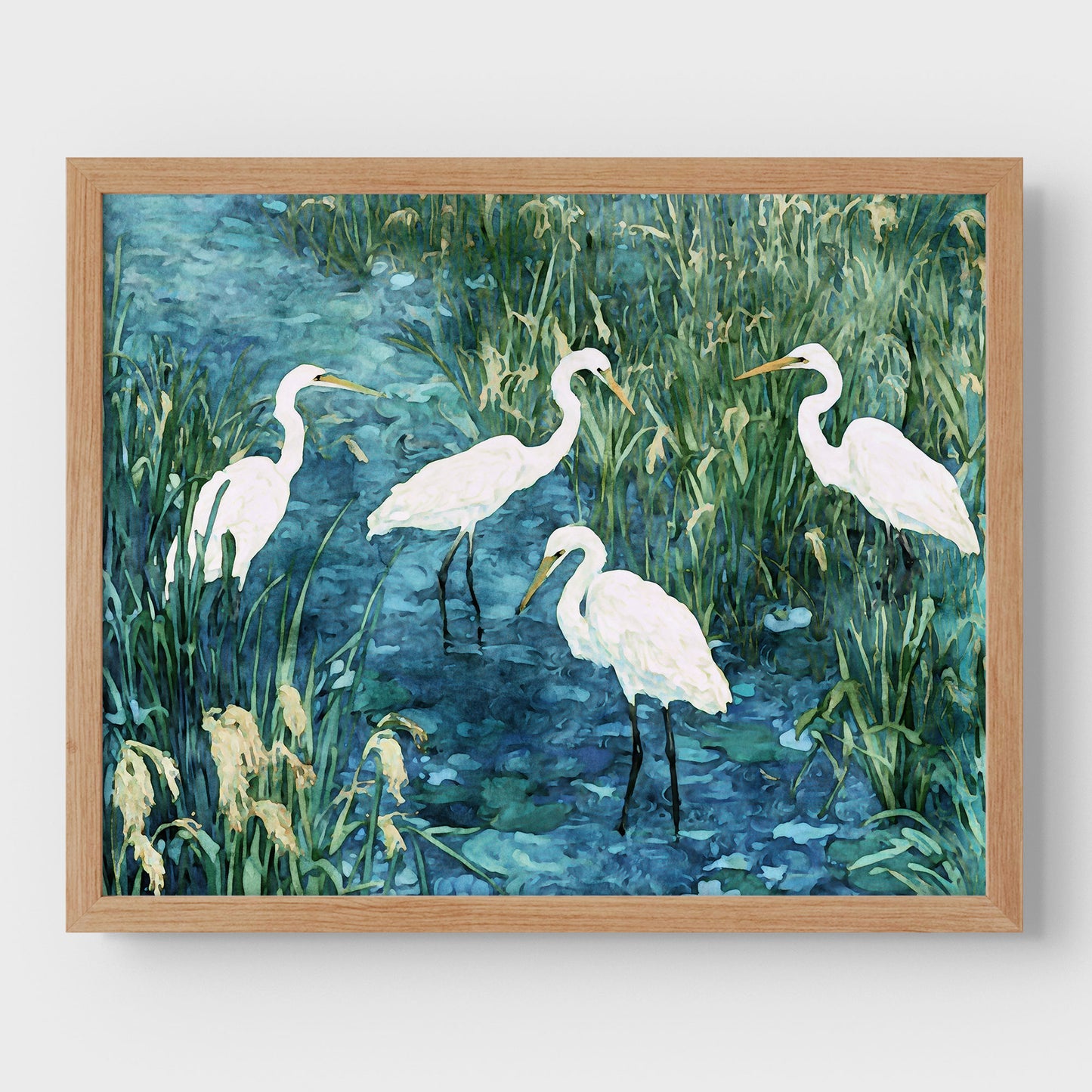 Framed artwork of four white birds in a natural setting