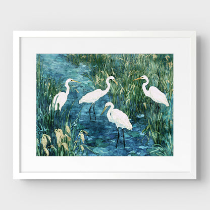 Framed artwork of four white herons in a marshy area with greenery.