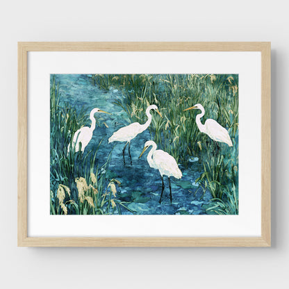 Framed artwork of four white birds in a natural setting with a light wooden frame.