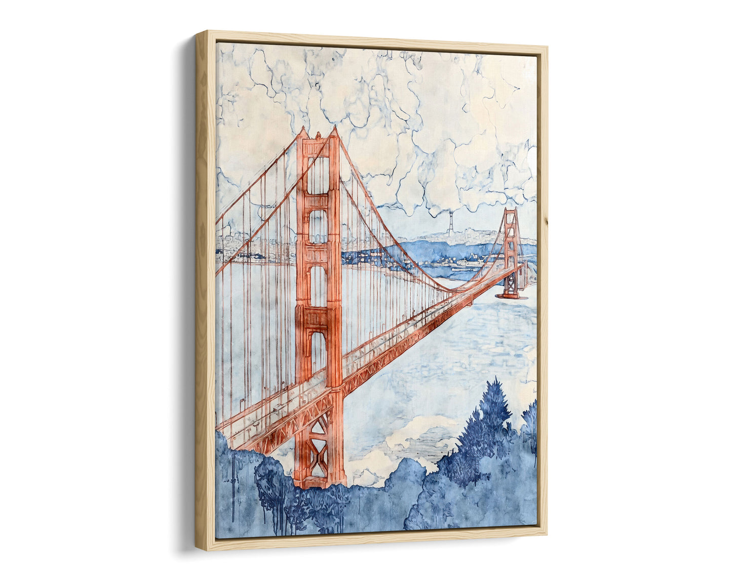 Natural wood framed canvas print of a watercolor-style Golden Gate Bridge painting, shown at a dramatic angle. The warm red-orange towers and cables contrast with a pale blue bay, cloudy sky, and deep navy trees in the foreground. The sleek black frame adds a modern touch to the soft, painterly design.