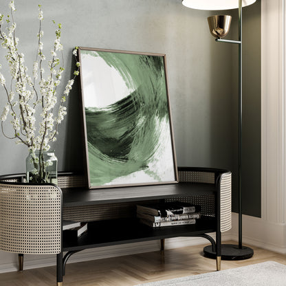 Black and Sage Green Modern Minimalist Abstract Brush Stroke Painting Print framed in walnut wood on display on modern rattan credenza