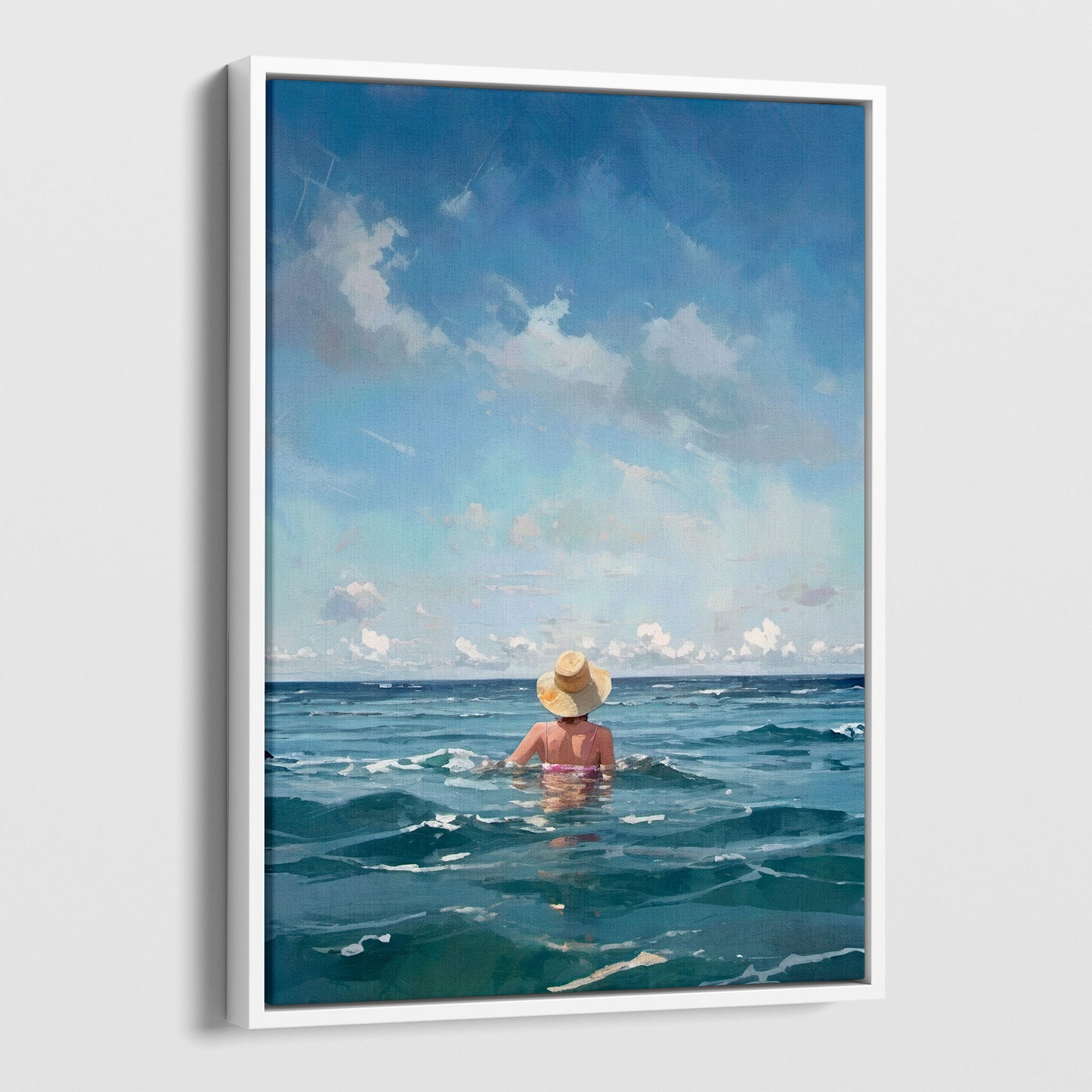 Painting of a woman wearing a straw hat and swimsuit, standing waist-deep in the ocean under a blue sky with scattered clouds. Artwork printed on gallery wrap canvas in white floater frame.