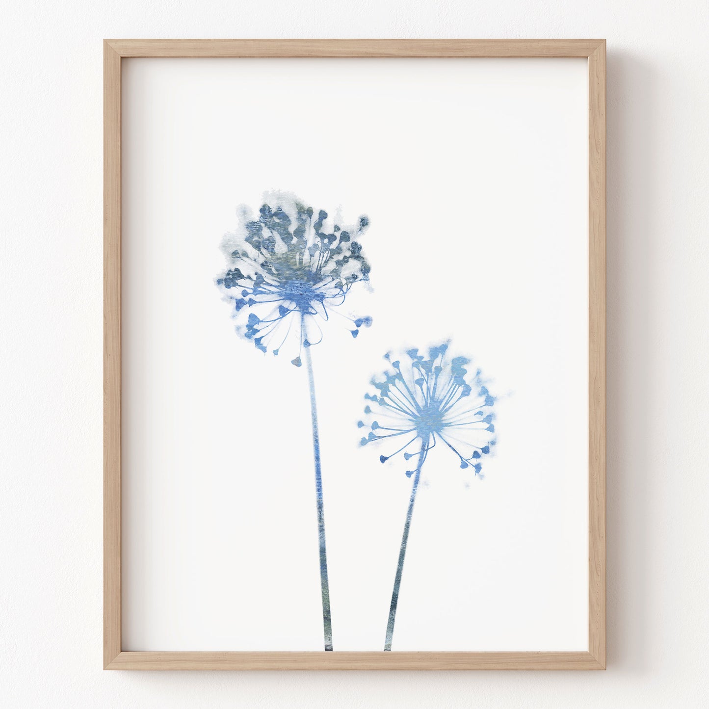 Framed artwork of blue floral design on a white background