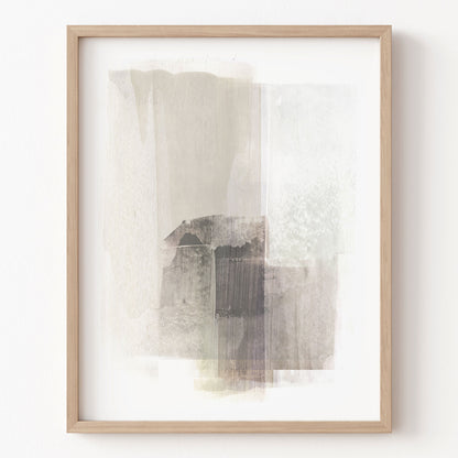Framed abstract art print on a white wall