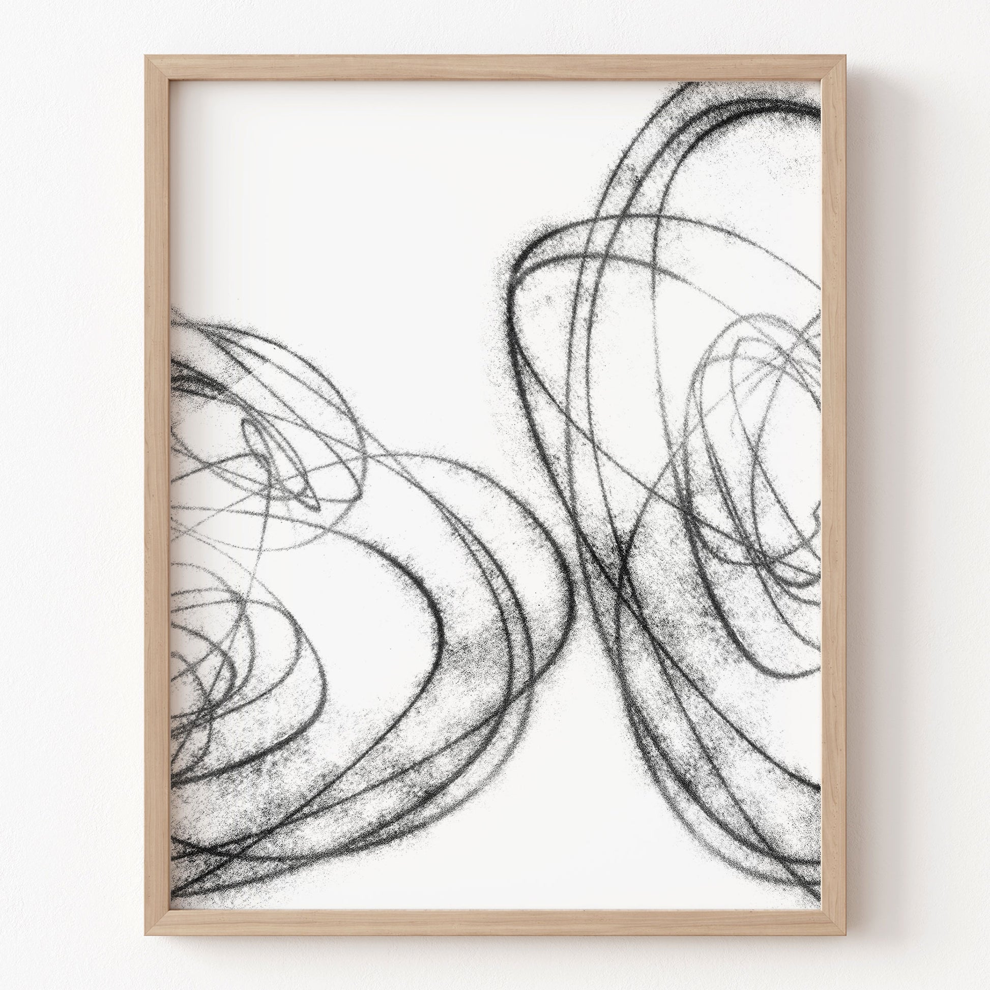 Framed abstract art print with black line drawings on a white background