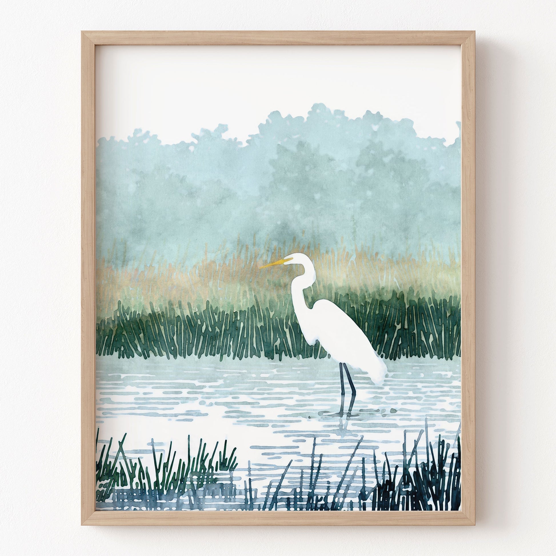Framed artwork of a white egret in a marshy landscape with reeds and water.