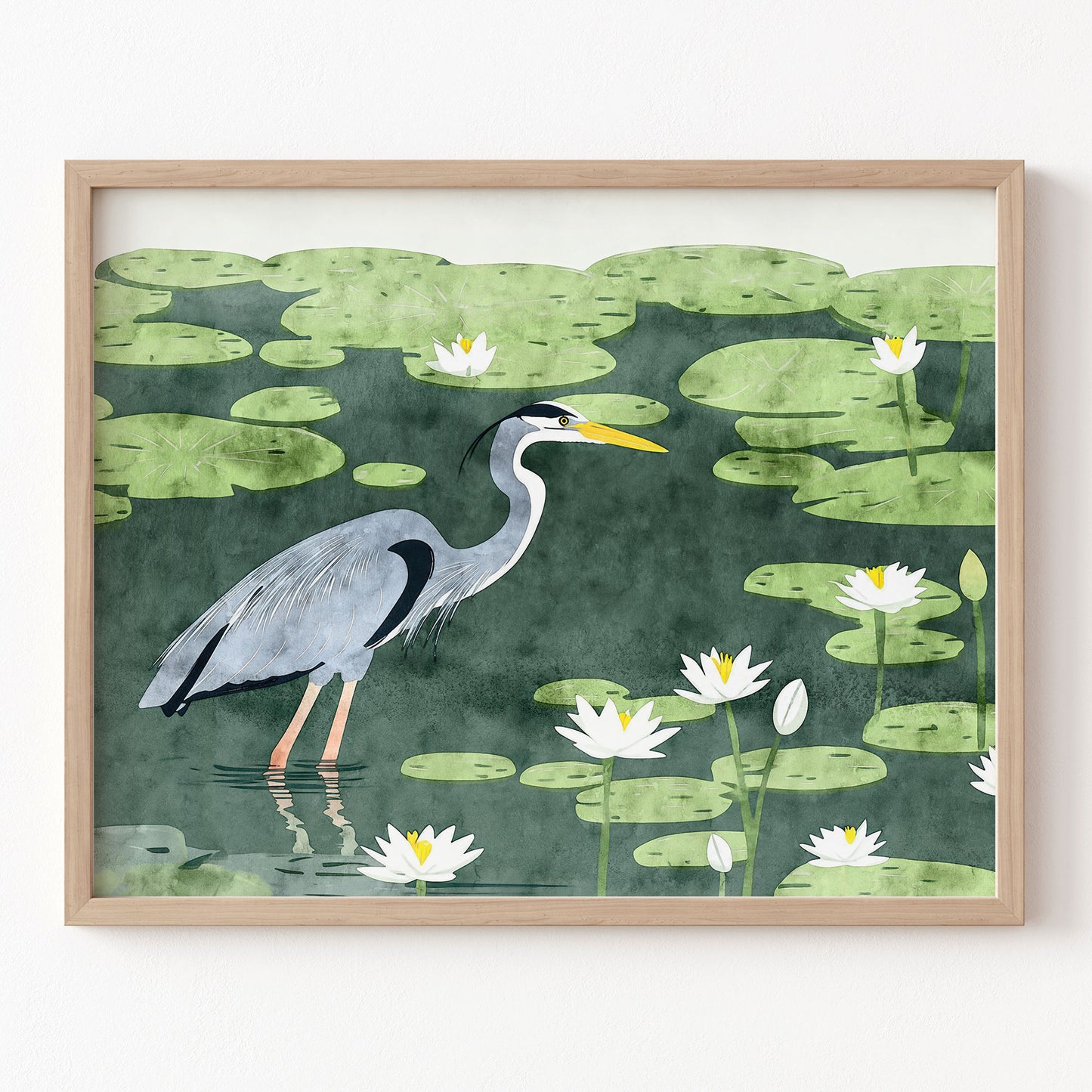 Framed artwork of a heron in a pond with lily pads and water lilies.