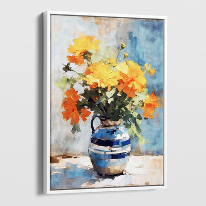 White framed canvas artwork featuring a watercolor-style depiction of a bouquet of vibrant orange and yellow marigold flowers arranged in a blue ceramic vase, set against a soft blue background.