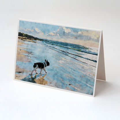 Tented folded note card with a pied French Bulldog beach watercolor and soft blue shoreline background.