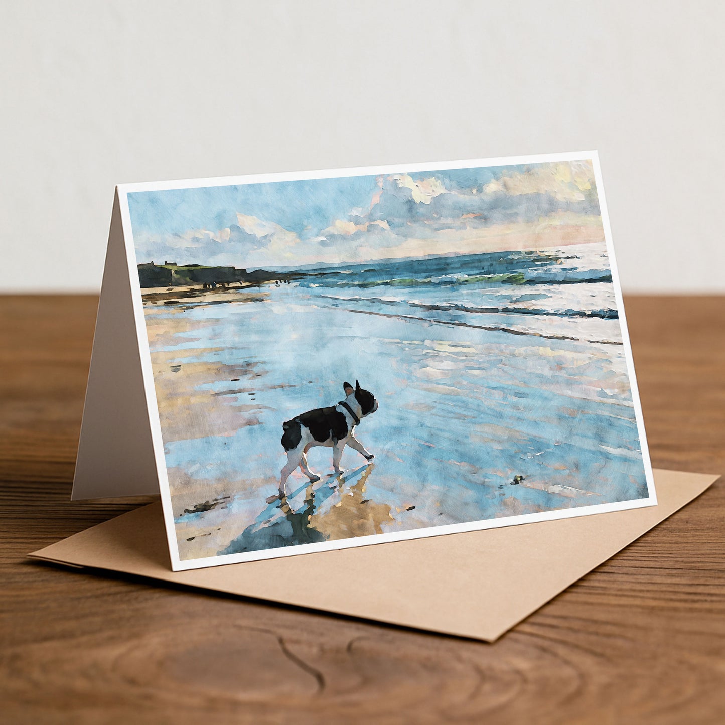 Pied French Bulldog beach note card styled on a tabletop with a calm coastal watercolor theme.