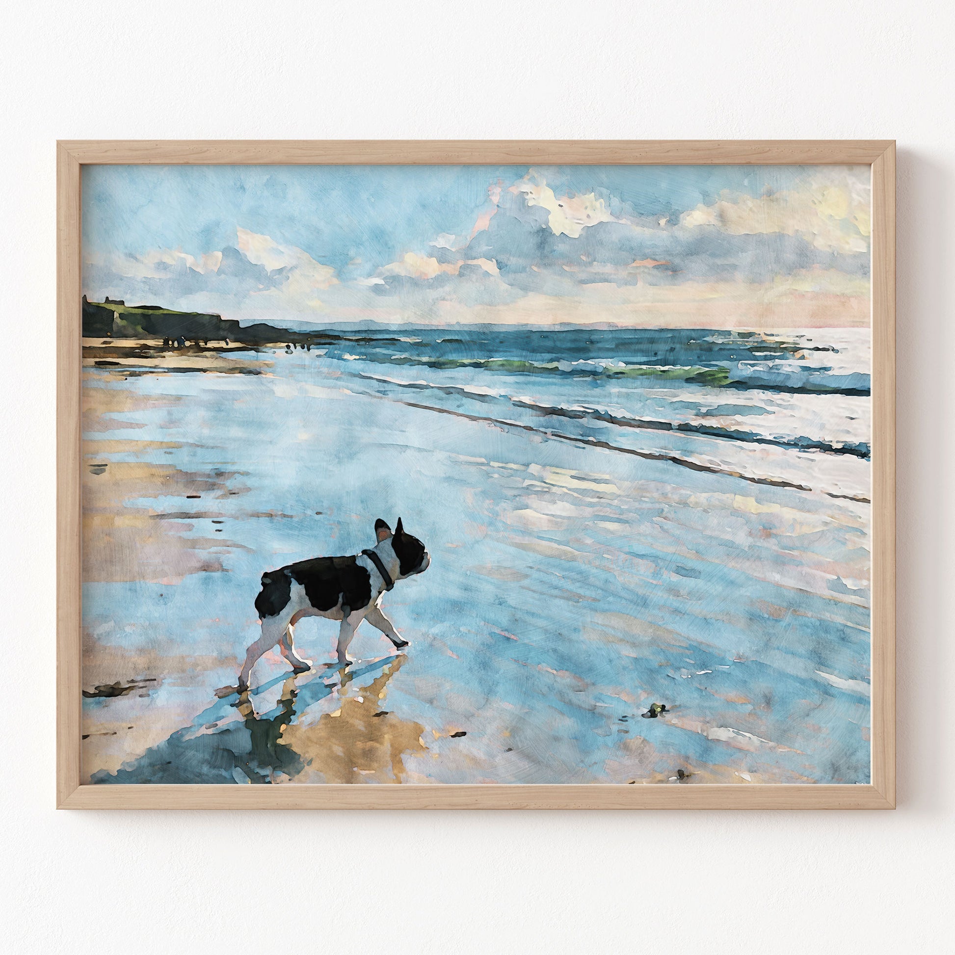 Digital watercolor print of a pied French Bulldog walking on a beach with blue ocean waves in a natural wood frame.