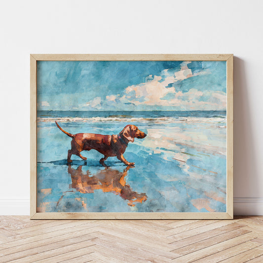 Horizontal watercolor-style painting of a red dachshund walking along a beach shoreline, its reflection mirrored in wet sand. Soft blue ocean waves and a bright sky with white clouds create a serene coastal backdrop. Warm brown tones of the dog contrast with cool blues, framed in light wood for a relaxed, airy feel.