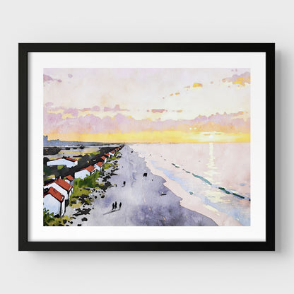 Framed artwork in black, showcasing a watercolor-style beach scene at sunrise, featuring pastel skies, a reflective ocean, and a row of houses along the shoreline.