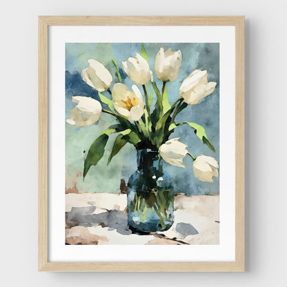 Framed watercolor painting of white tulips in a blue-green glass vase, set against a muted blue background. The artwork features a natural wood frame with a white border, enhancing its delicate and impressionist botanical style.