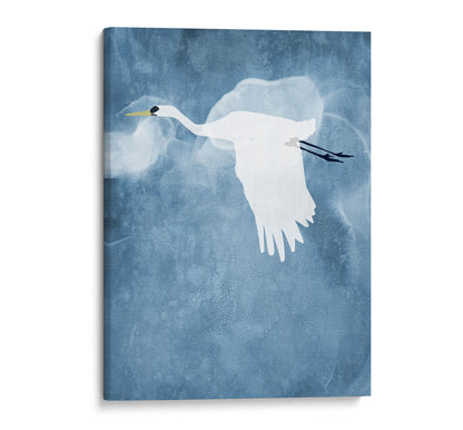 Minimalist canvas print of a white heron flying with wings lowered against a textured blue background with soft, swirling cloud-like shapes.
