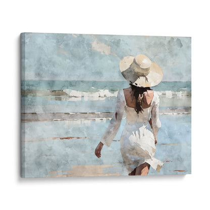 Watercolor painting of a woman in a white dress and wide-brimmed hat walking toward the ocean on a sandy beach, with waves in the background.  Artwork printed on gallery wrap canvas.