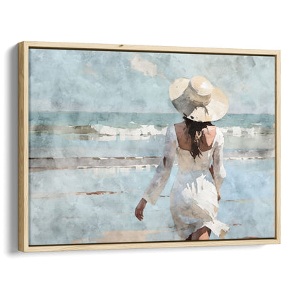 Watercolor painting of a woman in a white dress and wide-brimmed hat walking toward the ocean on a sandy beach, with waves in the background.  Artwork printed on gallery wrap canvas in natural floater frame.