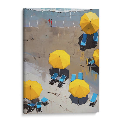 Painting of yellow beach umbrellas and blue lounge chairs on a sandy shore with two people in red walking in the background. Artwork is printed on gallery wrap canvas.